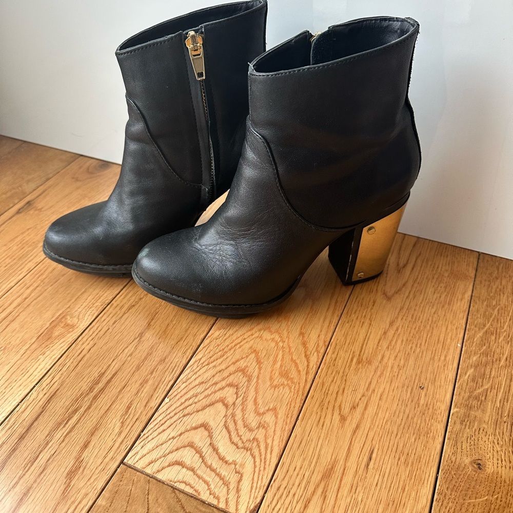 Elegant Black and Gold Heeled Boots